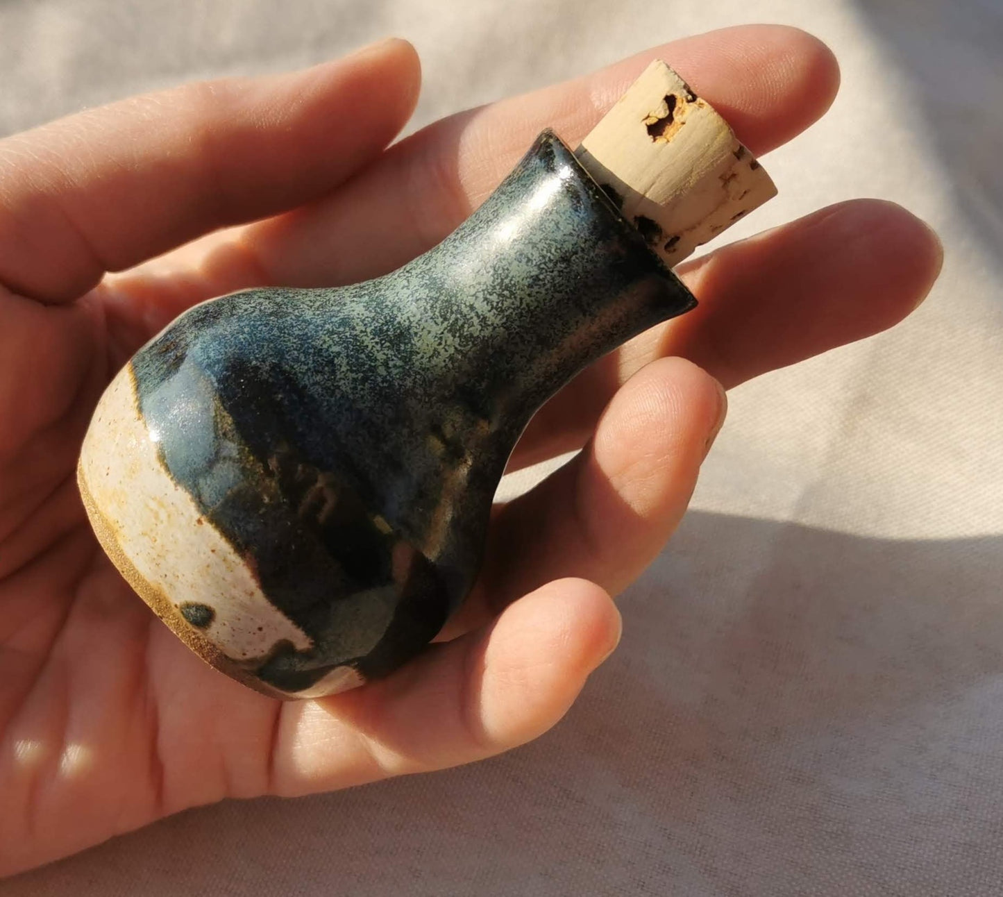 Green-sage ceramic bottle